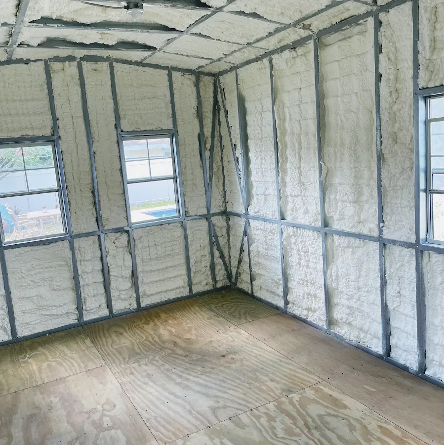 Closed-cell spray foam insulation applied to wall cavities in a residential project in Gladstone